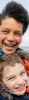 Woman and child playing on beach