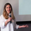 Image of a woman speaking with a microphone